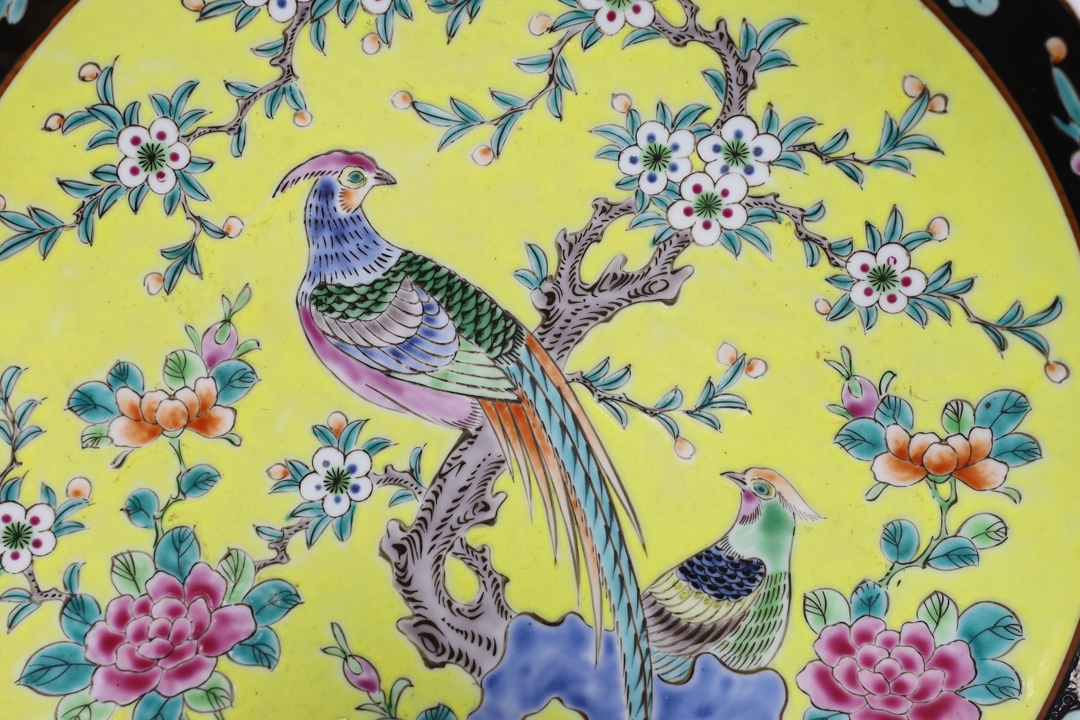 An early 20th century Japanese yellow ground dish with bird and floral decoration - 36.5cm diameter